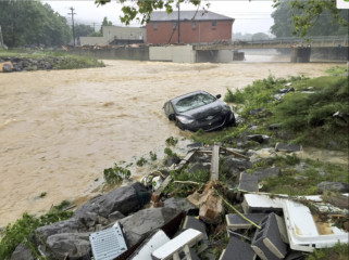 West Virginia floods A vehicle rests in a stream