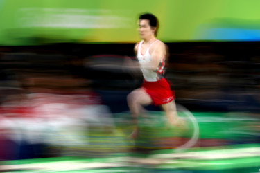 Olympians in motion: Gymnastics runner approaches vault