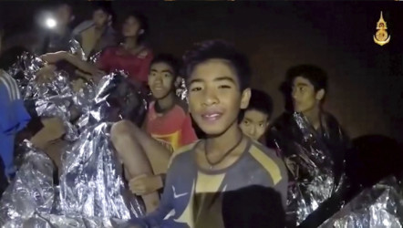Thailand Dealing With Darkness Trapped boys smile as Thai Navy SEAL medic helps