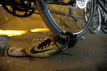 APTOPIX Thailand Cave Search soccer shoes are left next to bicycles