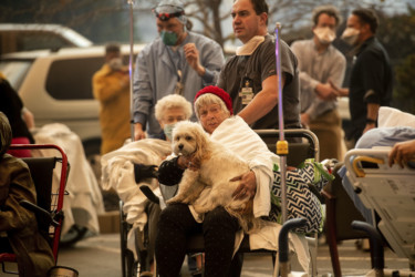 California Wildfires Medical personnel evacuate patients