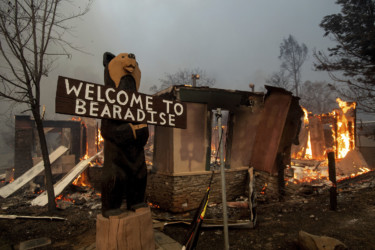 California Wildfires Flames consume a building