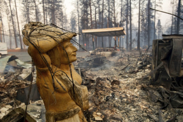 California Wildfires A statue rests amid a charred lot