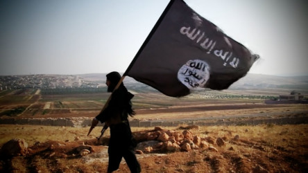 Iraq: War Continued ISIL soldier carrying flag