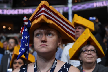 Wisconsin cheese delegates wearing hats that look like cheese