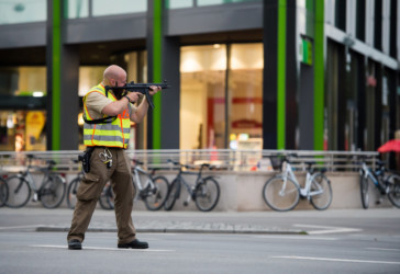 Police officer secures mall in Munch Officer secures mall in Munich following shooting
