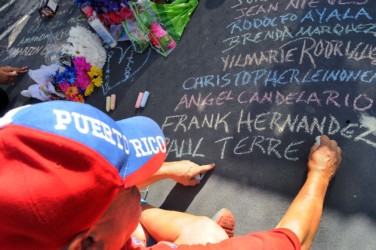 Orlando community continues to mourn deadly mass shooting at gay club pulse Edwin Rodriguez writes the names of the victims of the Pulse nightclub shooting in front of the clu