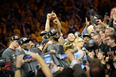 Cleveland Cavaliers win the 2016 NBA Finals, LeBron James #23 of the Cleveland Cavaliers and teammates celebrate with the Larry O'Brien NBA Championship Trophy