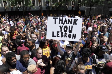 Cleveland Cavaliers victory parade and rally, Cleveland Cavaliers fans celebrate and hold up a sign during the Cleveland Cavaliers Victory Parade And Rally