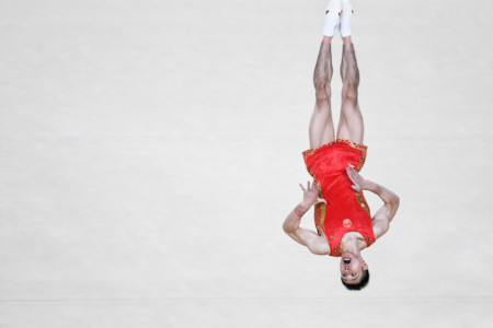 Chenglong Zhang of China competes on the floor during the men's team final in Rio 2016