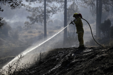 California Wildfires Firefighter hoses