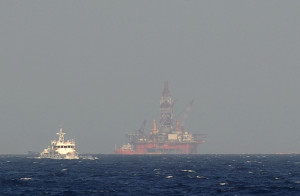 A Chinese coast guard vessel sails near China's oil drilling rig in disputed waters in the South China Sea.