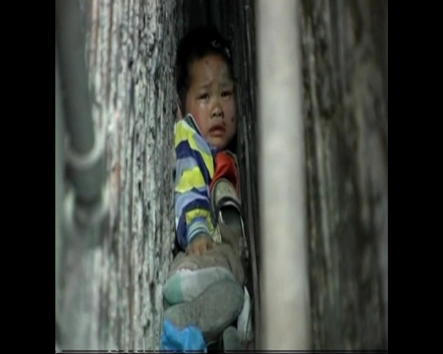Boy Trapped Between Walls