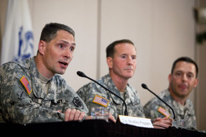 Colonel Bradley J. Kamrowski, Ph.D., Major General Joseph P. DiSalvo, and Colonel Ronald N. Wool deliver a press conference at the Fort Sam Houston Golf Course July 13, 2014 in San Antonio, Texas. They are reporting on Sgt. Bowe Bergdahl, his return to the United States, and reintegration at Brooke Army Medical Center after being a prison of war under Taliban captivity. 