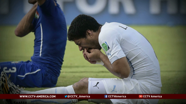 Uruguay striker Luis Suarez suspended for biting
