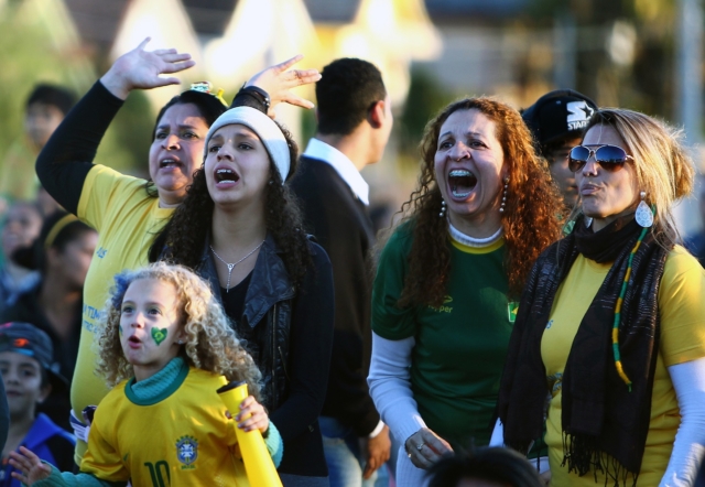 Brazilina fans react during the public viewing of the 2014 FIFA World Cup Brazil vs Germany semifinal