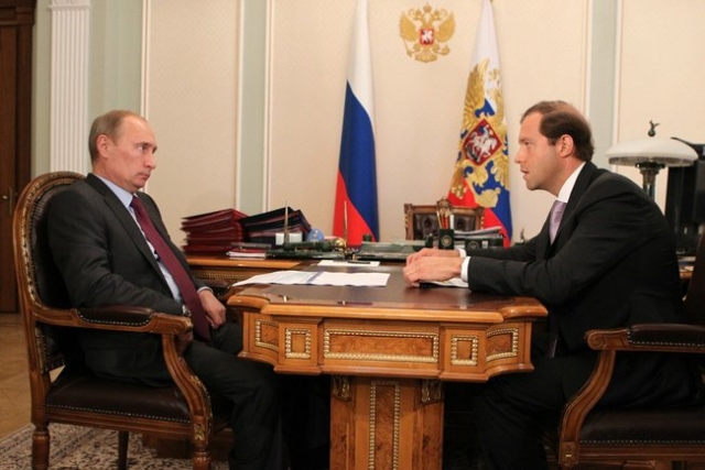 Russian President Vladimir Putin and Russian Trade Minister Denis Manturov