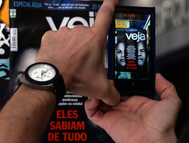 Brazilian taking picture of Magazine cover