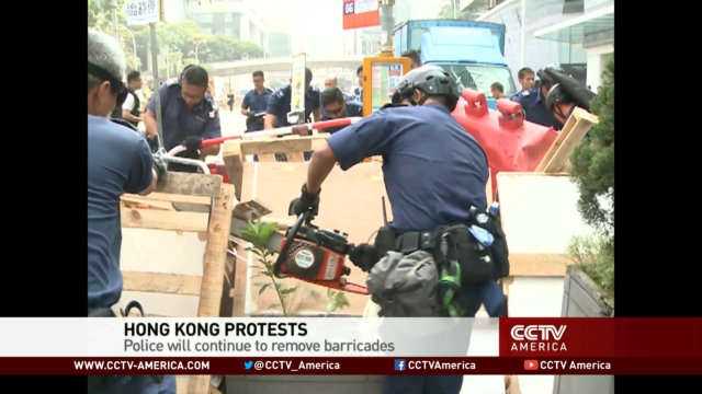 Police take down barricades in Hong Kong