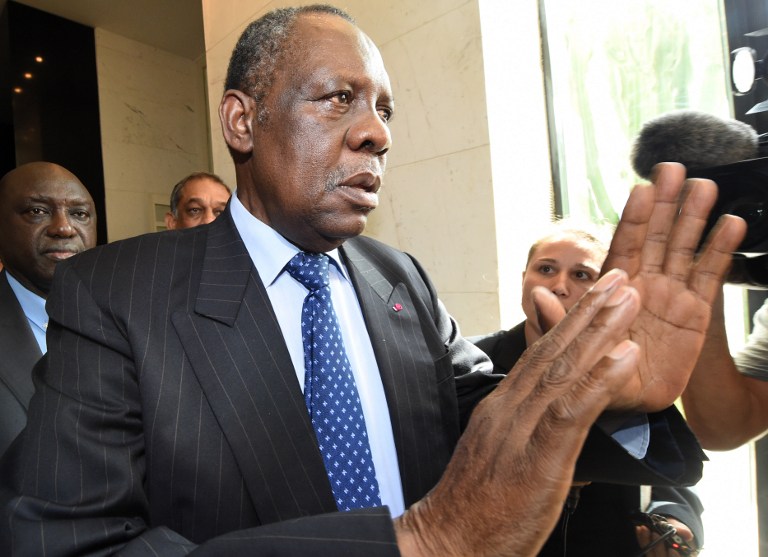 Issa Hayatou, president of the Confederation of African Football (CAF) leaves his hotel on November 3, 2014 in Rabat, ahead of his meeting to discuss Rabat's request to postpone hosting the 2015 Africa Cup of Nations due to the Ebola epidemic. 