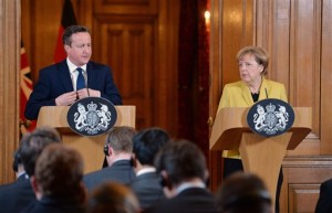 German Chancellor Angela Merkel, right, speaks during a joint news conference with British Prime Minister David Cameron on Jan. 7, 2015. Cameron and Merkel expressed their condolences and support to French President Francois Hollande after the deadly gun attack on satirical newspaper Charlie Hebdo. (AP Photo/John Stillwell, Pool)