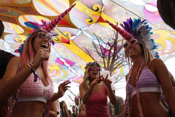 Israelis dressed in costumes dance in a desert rave during the feast of Purim on March 7, 2015 in the Negev Desert in southern Israel. The carnival-like Purim holiday is celebrated with parades and costume parties to commemorate the deliverance of the Jewish people from a plot to exterminate them in the ancient Persian empire 2,500 years ago, as recorded in the Biblical Book of Esther. AFP /Gali Tibbon