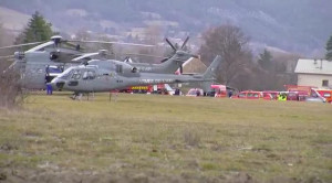 Army rescue helicopters park in Seyne, French Alps, Tuesday, March 24, 2015.  As search-and-rescue teams struggled to get to the remote, snow-covered region, France's president warned that no survivors were expected. (AP Photo/D!CI TV) 