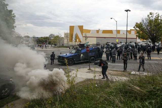 BALTIMORE, MD - APRIL 27: Baltimore Police officers confront protestors on Reisterstown Road near Mondawmin Mall, April 27, 2015 in Baltimore, Maryland. The funeral service for Freddie Gray, who died last week while in Baltimore Police custody, was held on Monday morning. Drew Angerer/Getty Images/AFP