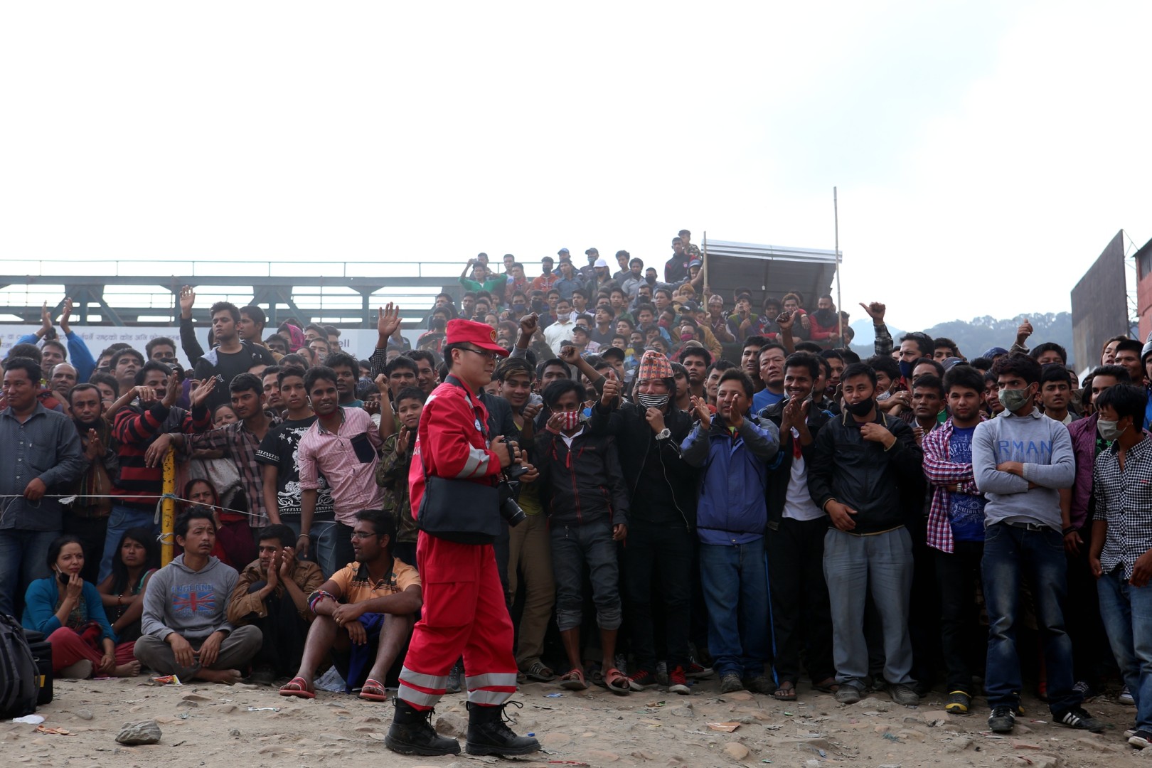 Nepalese cheer after China International Search and Rescue Team rescued a survior in Kathmandu, capital of Nepal, on April 26, 2015. China International Search and Rescue Team rescued the first survivor during its humanitarian mission following a fatal quake in Nepal. (Xinhua/Bai Yang)
