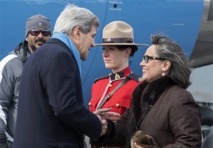 United States Secretary of State John Kerry is greeted by Leona Aglukkaq, Canadian Minister for the Arctic Council, as he arrives Friday in Iqaluit, Nunavut.   (Paul Chiasson/The Canadian Press via AP)   MANDATORY CREDIT