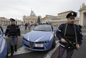 FILE - In this Saturday, Jan. 10, 2015 file photo, Italian police officers patrol outside St. Peter's Square in Rome. Islamic extremists suspected in a bomb attack in a Pakistani market that killed more than 100 people had also planned an attack against the Vatican in 2010 that was never carried out, an Italian prosecutor said Friday. (AP Photo/Gregorio Borgia, File)