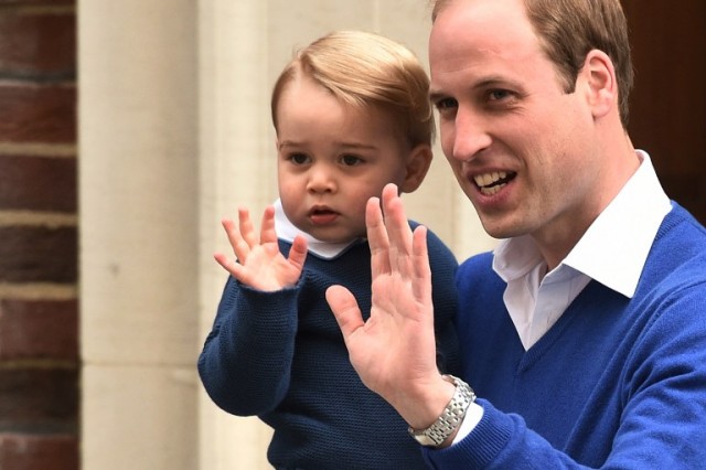 Britain's Prince William, Duke of Cambridge (R), and his son Prince George of Cambridge wave as they return to the Lindo Wing at St Mary's Hospital in central London, on May 2, 2015 where his wife Catherine, Duchess of Cambridge, gave birth to their second child, a baby girl, earlier in the day. The Duchess of Cambridge was safely delivered of a daughter weighing 8lbs 3oz, Kensington Palace announced. The newly-born Princess of Cambridge is fourth in line to the British throne.     AFP PHOTO / LEON NEAL