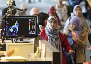 A thermal camera monitor shows the body temperature of passengers arriving from overseas against possible MERS, Middle East Respiratory Syndrome, virus at the Incheon International Airport in Incheon, South Korea Thursday, May 21, 2015. South Korea said Thursday it has confirmed three cases of a respiratory virus that has killed hundreds of people in Saudi Arabia. (Kim Ju-sung/Yonhap via AP) KOREA OUT