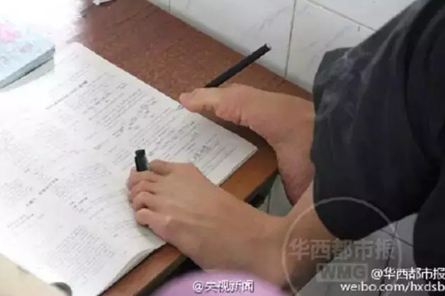Armless student passes gaokao with feet