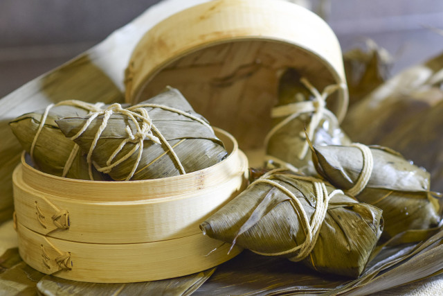 In The Kitchen: Making zongzi (Rice packets in bamboo leaves)