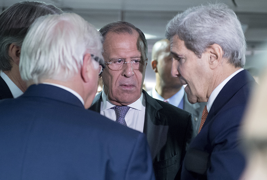 German Minister for Foreign Affairs Frank-Walter Steinmeier, left, Russian Foreign Minister Sergey Lavrov, center, and US Secretary of State John Kerry talk prior to the last plenary session at the United Nations building in Vienna, Austria, Tuesday, July 14, 2015. (Joe Klamar/Pool Photo via AP)