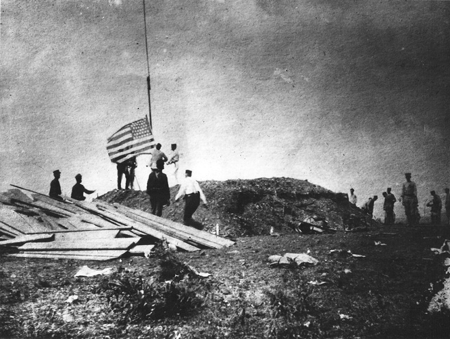 The First Marine Battalion, commanded by Lieutenant Colonel Robert W. Huntington, landed on the eastern side of Guantanamo Bay, Cuba, on 10 June 1898. The next day, an American flag was hoisted above Camp McCalla where it flew during the next eleven days. (United States Marine Corps)