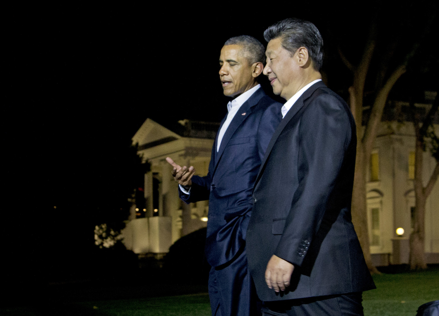President Barack Obama and Chinese President Xi Jinping, right, walk on the North Lawn of the White House in Washington, Thursday, Sept. 24, 2015, for a private dinner at the Blair House, across the street from the White House. Xi arrived in Washington late Thursday for a State Visit. Obama has invested more time building personal ties with the Chinese president than with most other world leaders. (AP Photo/Manuel Balce Ceneta)