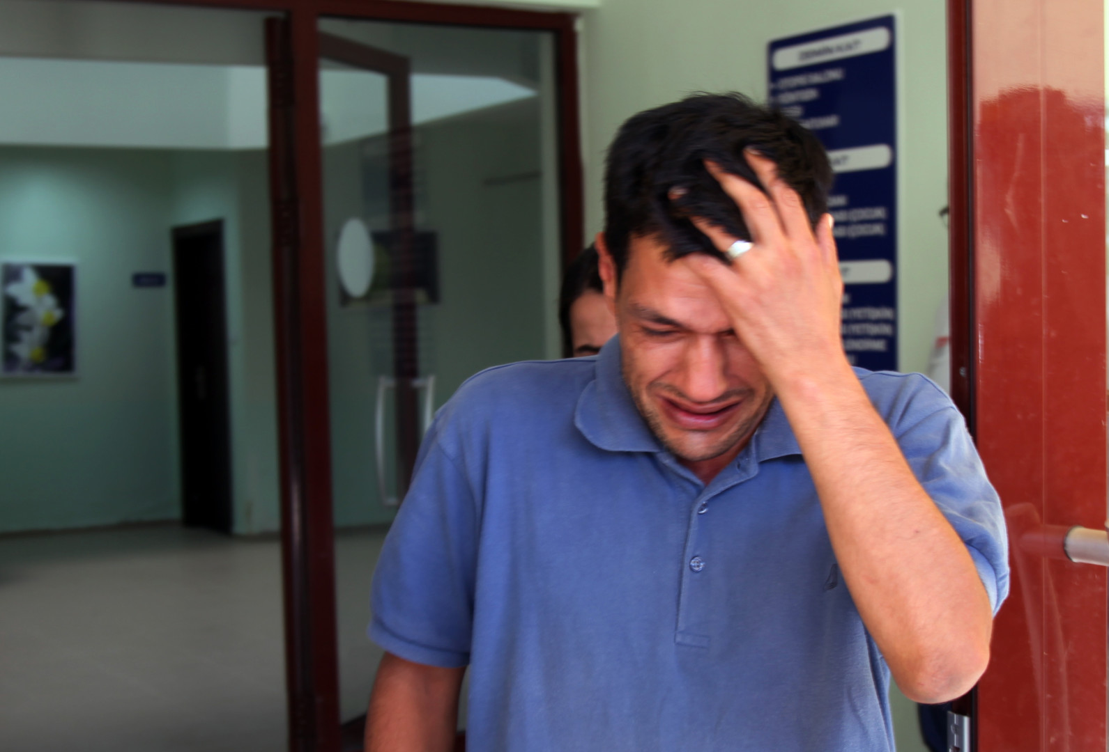 Abdullah Kurdi, 40, father of Syrian boys Aylan, 3, and Galip, 5, who were washed up drowned on a beach near Turkish resort of Bodrum on Wednesday, cries as he waits for the delivery of their bodies outside a morgue in Mugla, Turkey, Thursday, Sept. 3, 2015.(AP Photo/Mehmet Can Meral)