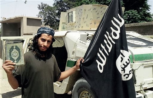 This undated image made available in the Islamic State's English-language magazine Dabiq, shows Abdelhamid Abaaoud. Abaaoud, the child of Moroccan immigrants who grew up in the Belgian capitals Molenbeek-Saint-Jean neighborhood, was identified by French authorities on Monday Nov. 16, 2015, as the presumed mastermind of the terror attacks last Friday in Paris that killed over a hundred people and injured hundreds more. (Militant Photo via AP)
