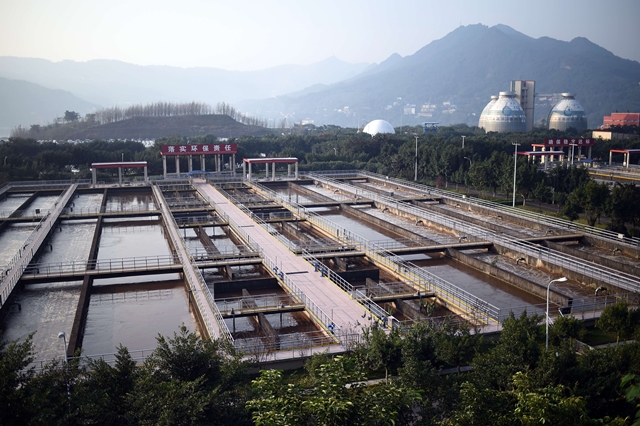 A picture taken on November 2, 2015 shows the Sino French Tangjiatuo Wastewater treatment company site in Chongqing. AFP PHOTO, STEPHANE DE SAKUTIN