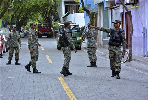 Maldives National Defense Force (MNDF) personnel patrol the streets after a state of emergency was declared in Male, Maldives, Wednesday, Nov. 4, 2015. The president of the Maldives declared a state of emergency on Wednesday.(Sharwaan/Sun Online via AP) NO ARCHIVE NO SALES