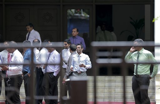 Members of the Parliament come out after voting on the impeachment motion against Vice-President Ahmed Adeeb in Male, Maldives, Thursday, Nov. 5, 2015. Maldives' Parliament Thursday voted overwhelmingly to impeach the country's vice president, who has been accused of plotting to kill the president. (AP Photo/Sinan Hussain)