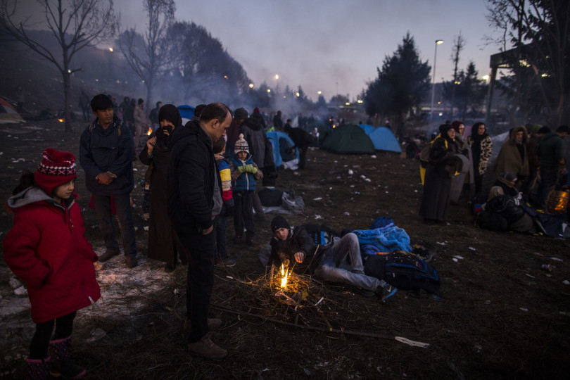 Migrants rest near the Slovenian-Austrian border, before being allowed to cross the border, at Sentilj, Slovenia, Monday Oct. 2, 2015. The influx of many hundreds of thousands of migrants into the European bloc over this year, is putting extreme pressure on local communities especially in border countries. (AP Photo /Manu Brabo)