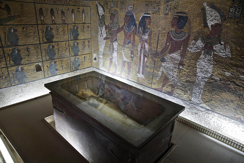 FILE -- In this Tuesday, Sept. 29, 2015 file photo, the tomb of King Tut is displayed in a glass case at the Valley of the Kings in Luxor, Egypt, Tuesday. On Saturday, Nov. 28, 2015, Antiquities Minister Mamdouh el-Damaty said there is a 90 percent chance that hidden chambers will be found within King Tutankhamun's tomb, based on the preliminary results of a new exploration of the 3,300-year-old mausoleum. (AP Photo/Nariman El-Mofty, File)