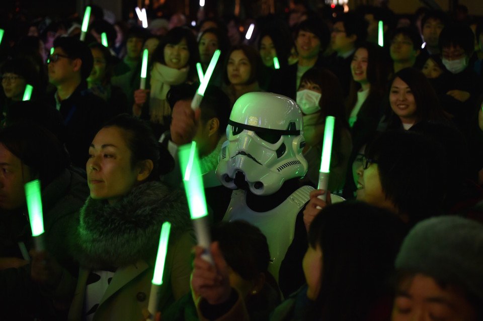 A fan dressed as a Stormtrooper is seen amid other fans as they gather for a promotional event for the upcoming Star Wars film. AFP PHOTO / KAZUHIRO NOGI