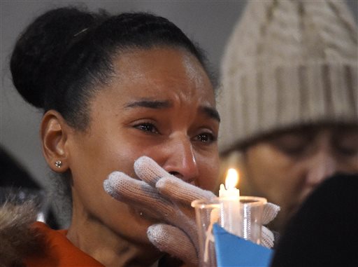 A woman cries during a vigil for shooting victims at San Manuel Stadium, Thursday, Dec. 3, 2015, in San Bernardino, Calif. (AP Photo/Mark J. Terrill)