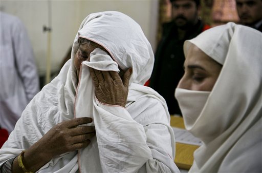 A Pakistani mother cries after her son was injured in an attack in Charsadda town, some 35 kilometers (21 miles) outside the city of Peshawar, Pakistan, Wednesday, Jan. 20, 2016. Gunmen stormed Bacha Khan University named after the founder of an anti-Taliban political party in the country's northwest Wednesday, killing many people, officials said. (AP Photo/B.K. Bangash)