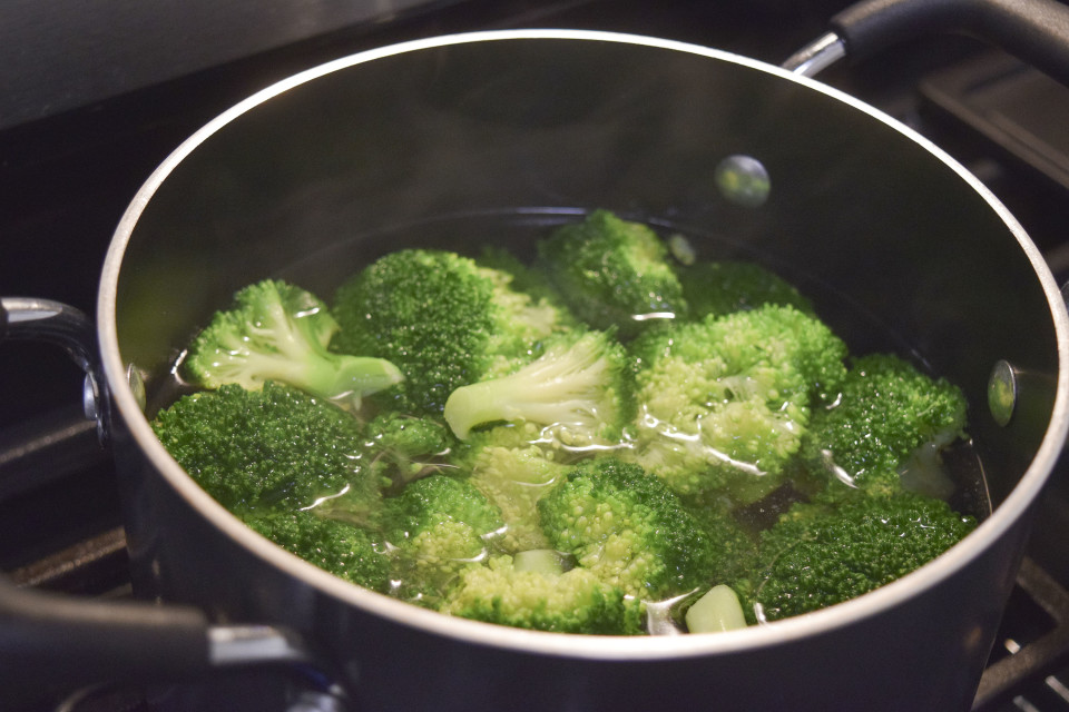 Boil broccoli, then immediately transfer to ice water (this will prevent broccoli from overcooking)