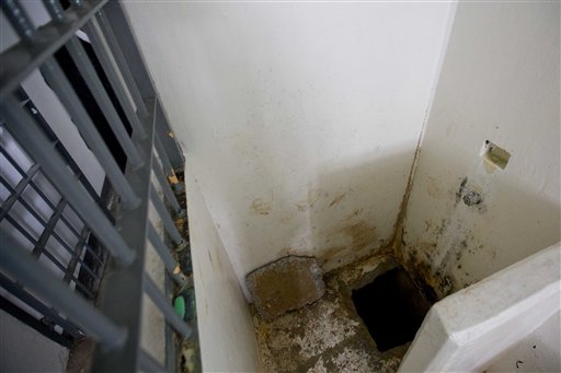FILE.- This July 15, 2015 photo shows the shower area where authorities claim drug lord Joaquin "El Chapo" Guzman, slipped into a tunnel to escape from his prison cell. (AP Photo/Eduardo Verdugo, File)